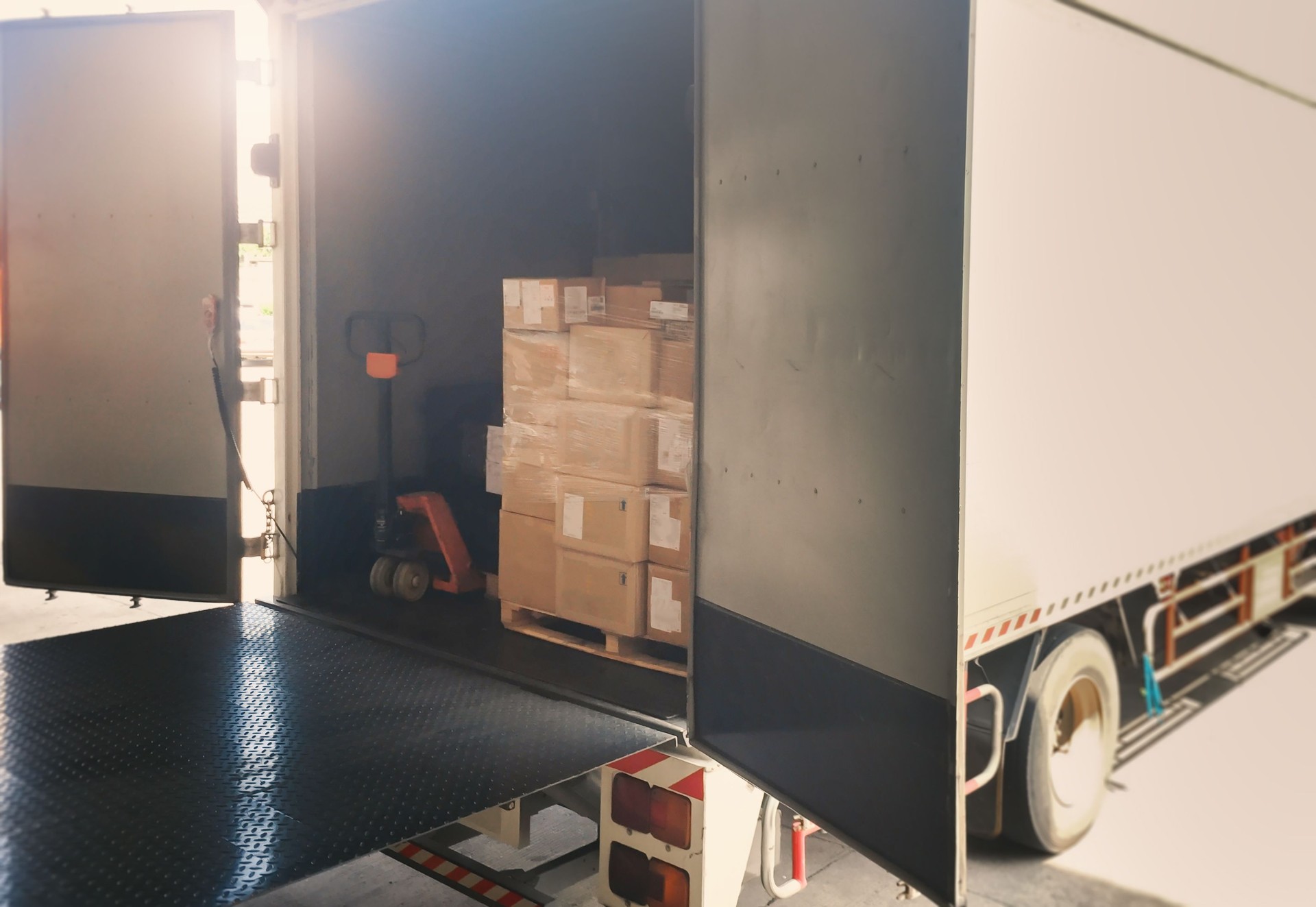 Package Boxes Stack on Wooden Pallets Loading into Container Trucks. Distribution Supplies Warehouse Shipping. Supply Chain, Shipment. Freight Truck Logistic, Cargo Transport.